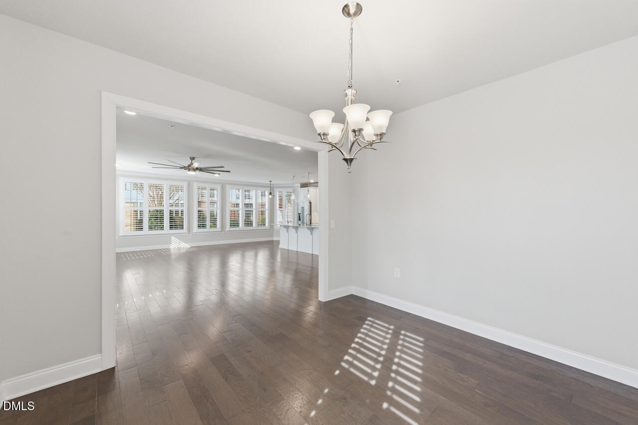 10210 Sablewood Drive, Unit 114 Raleigh, NC 27617 - Photo 16 of 28 a view of an empty room with wooden floor