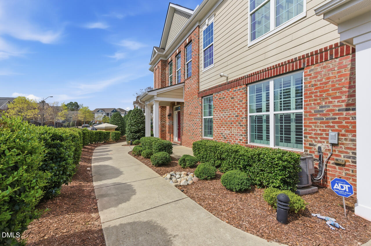 10210 Sablewood Drive, Unit 114 Raleigh, NC 27617 - Photo 2 of 28 a view of a house with potted plants