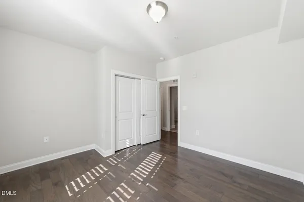 a view of a livingroom with wooden floor