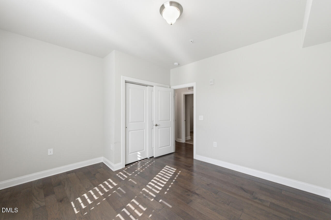 10210 Sablewood Drive, Unit 114 Raleigh, NC 27617 - Photo 23 of 28 a view of a livingroom with wooden floor