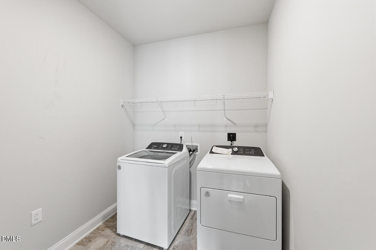 10210 Sablewood Drive, Unit 114 Raleigh, NC 27617 - Photo 25 of 28 a utility room with dryer and washer