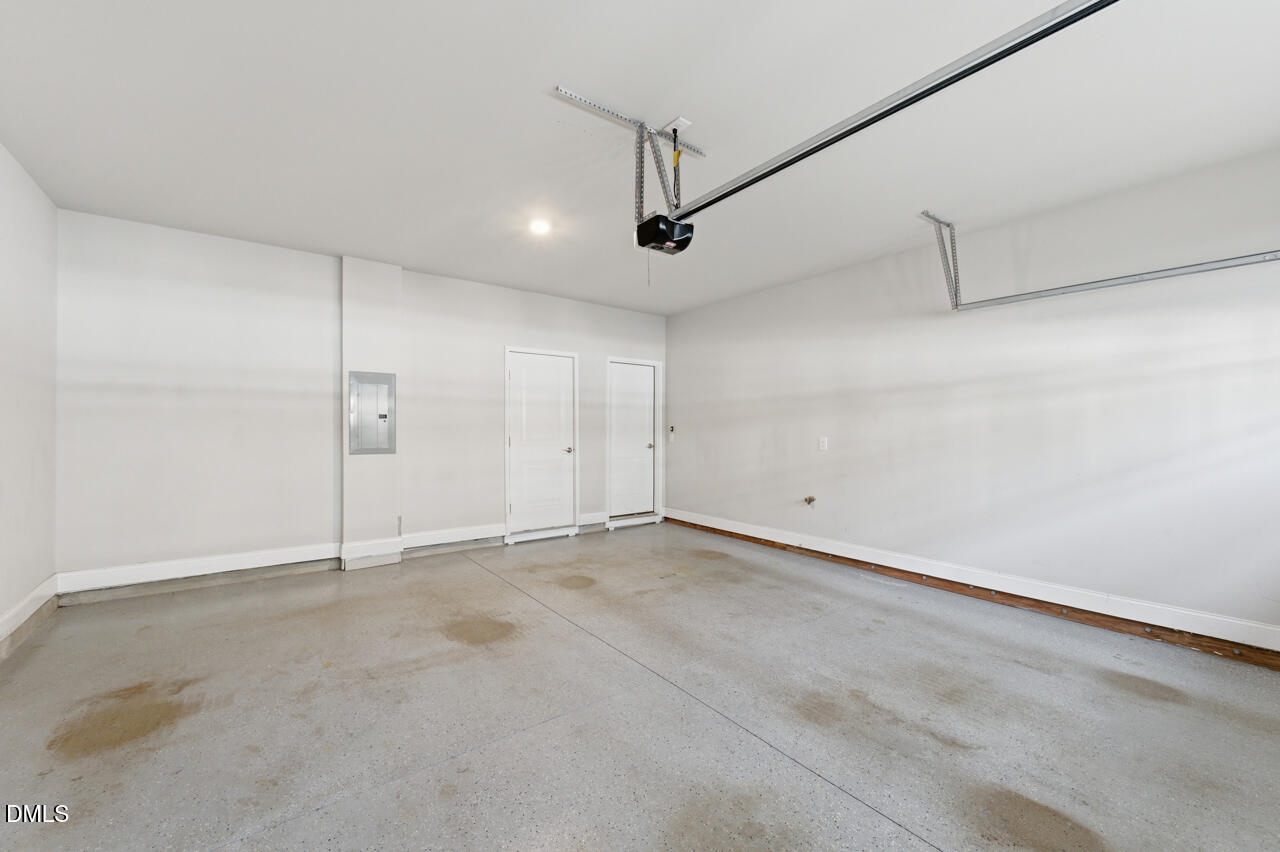 10210 Sablewood Drive, Unit 114 Raleigh, NC 27617 - Photo 28 of 28 an empty room with ceiling fan and windows