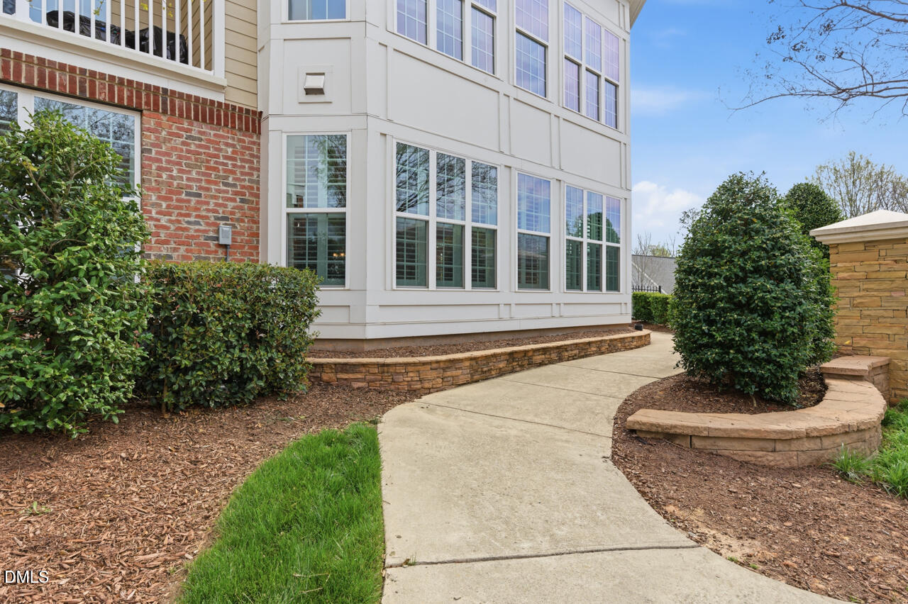 10210 Sablewood Drive, Unit 114 Raleigh, NC 27617 - Photo 3 of 28 a front view of a house having yard
