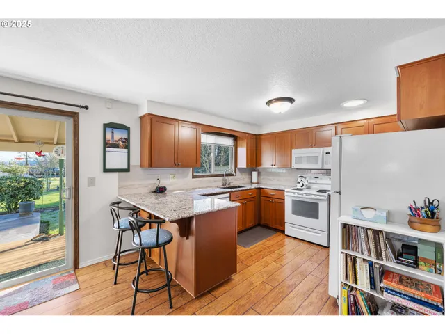a living room with furniture dining table and a large window