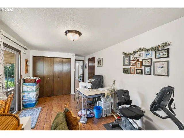 a bed room with a bed and paintings on the wall