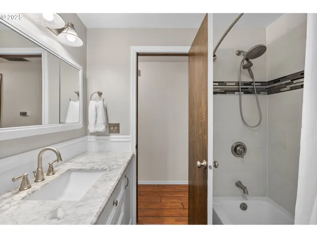 a bedroom with a bed and a table in it