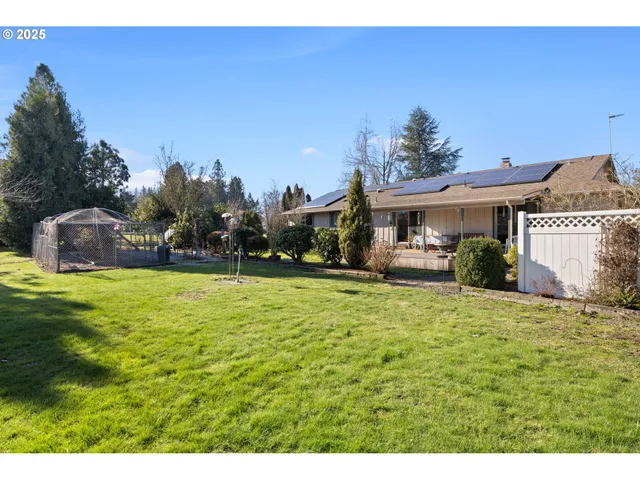a balcony with furniture and a garden