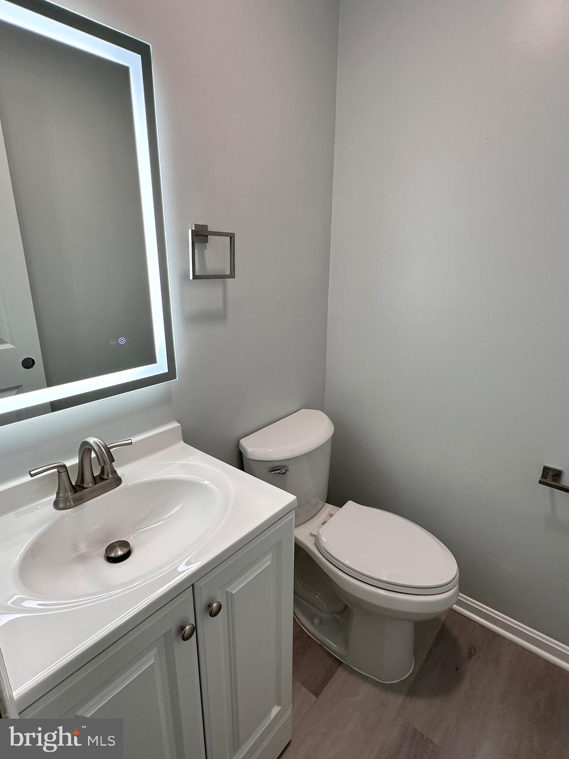 7411 Reservation Drive Springfield, VA 22153 - Photo 11 of 30 a bathroom with a sink a toilet and mirror