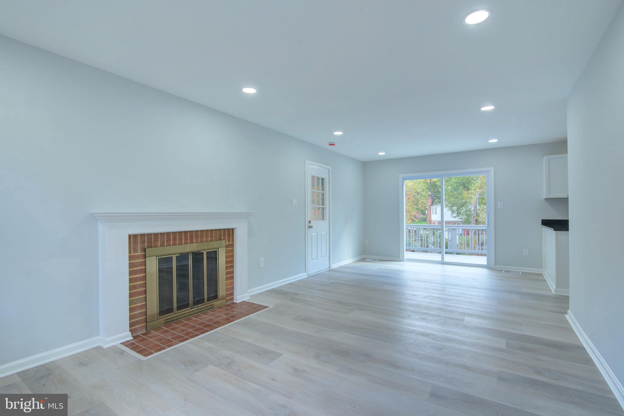 7411 Reservation Drive Springfield, VA 22153 - Photo 6 of 30 a view of an empty room with wooden floor and a window