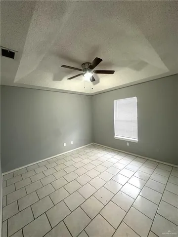 a view of an empty room and a window