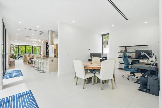 a bedroom with a bed and large window