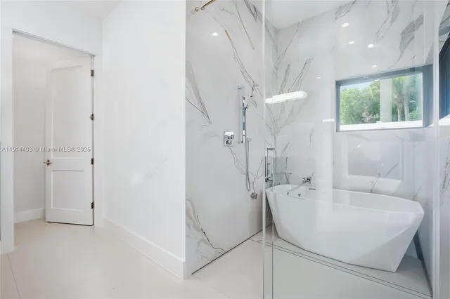 a kitchen with stainless steel appliances granite countertop a stove and a refrigerator