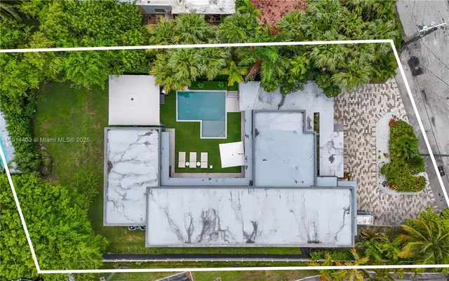 an aerial view of residential houses with city view