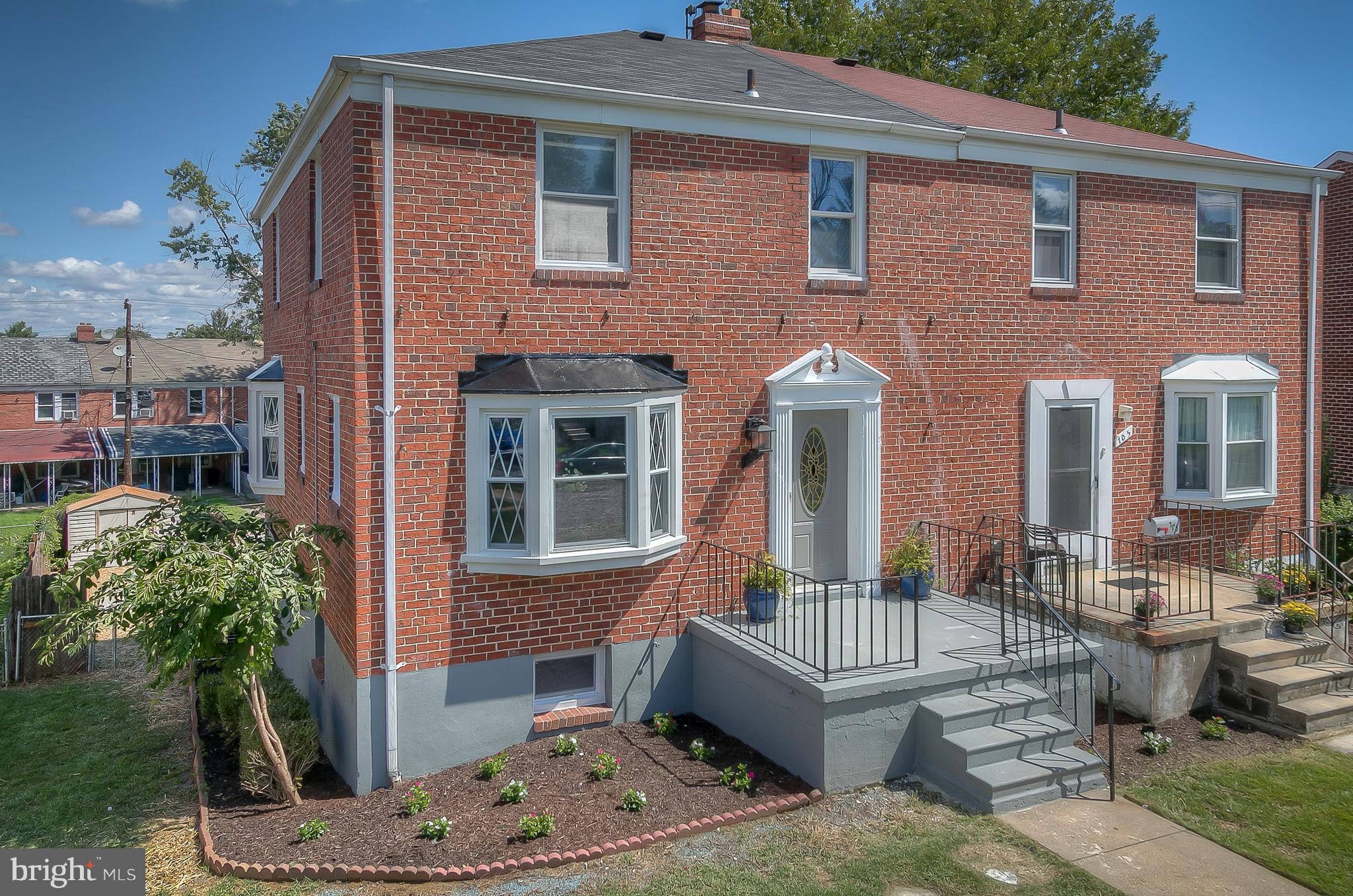 707 Stamford Road Baltimore, MD 21229 - Photo 1 of 30 a front view of a house with a garden