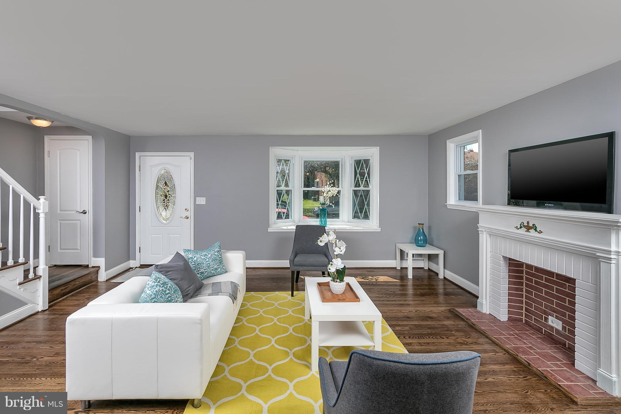 707 Stamford Road Baltimore, MD 21229 - Photo 11 of 30 a living room with furniture and a flat screen tv