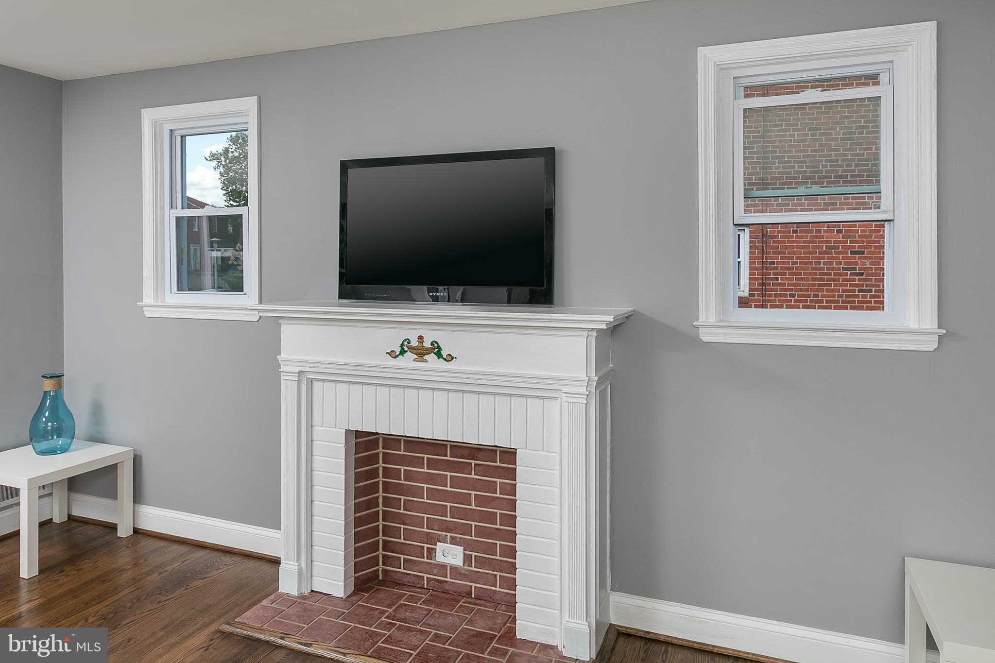 707 Stamford Road Baltimore, MD 21229 - Photo 14 of 30 a living room with a fireplace and a flat screen tv
