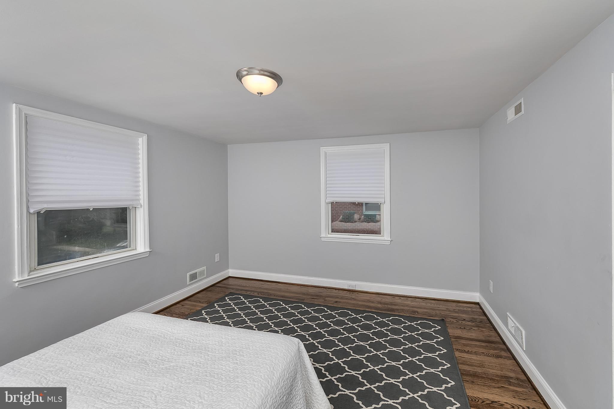 707 Stamford Road Baltimore, MD 21229 - Photo 17 of 30 a bedroom with a bed and a window