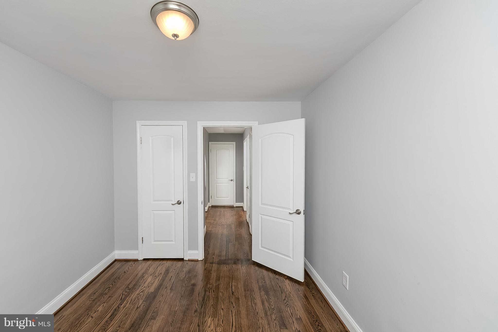 707 Stamford Road Baltimore, MD 21229 - Photo 21 of 30 a view of a room with wooden floor and a window