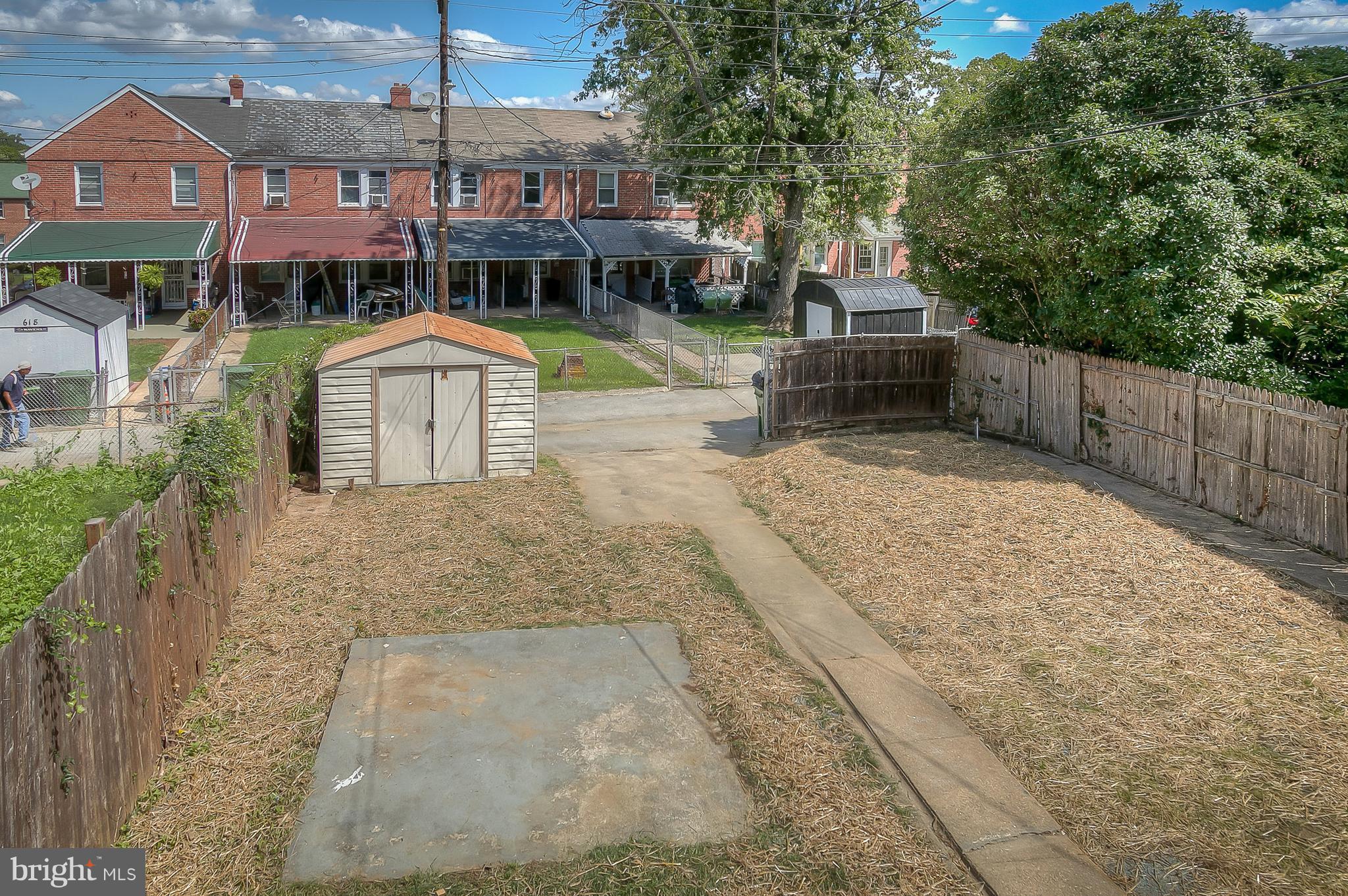 707 Stamford Road Baltimore, MD 21229 - Photo 29 of 30 a front view of a house with a yard
