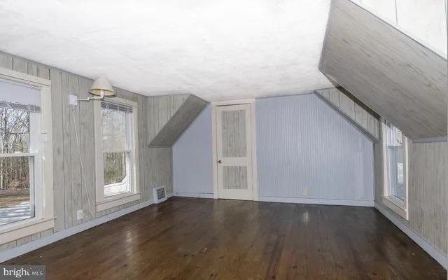 a view of entryway with wooden floor