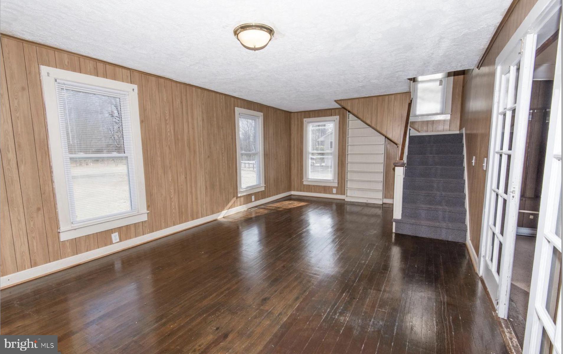 126 Ramoth Church Road Stafford, VA 22554 - Photo 7 of 17 an empty room with wooden floor and windows