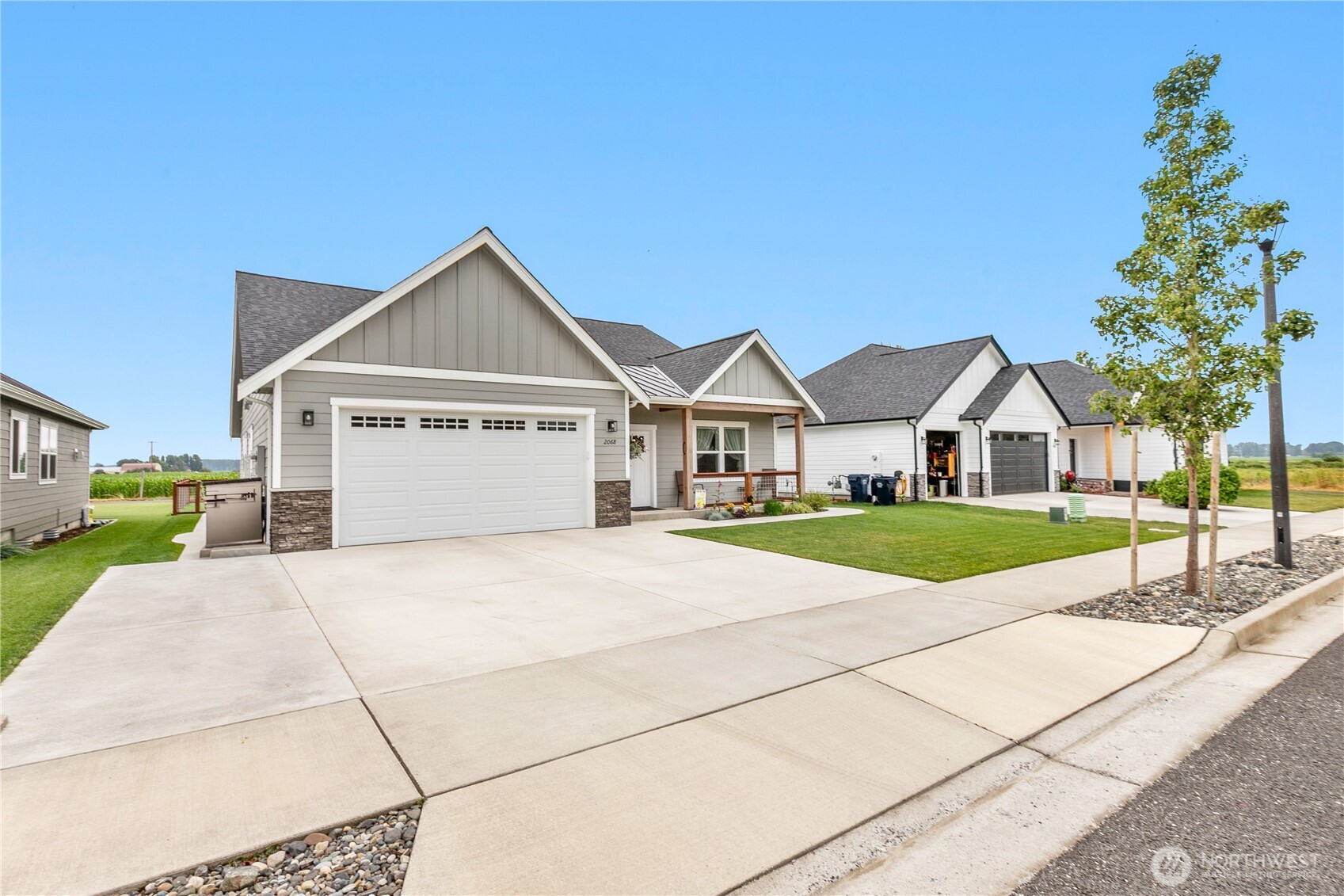 2068 Bowfin Way Lynden, WA 98264 - Photo 2 of 35 a view of house with street and trees in the background