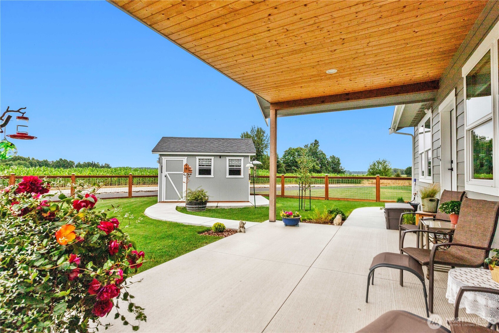 2068 Bowfin Way Lynden, WA 98264 - Photo 25 of 35 a view of a patio with table and chairs and potted plants