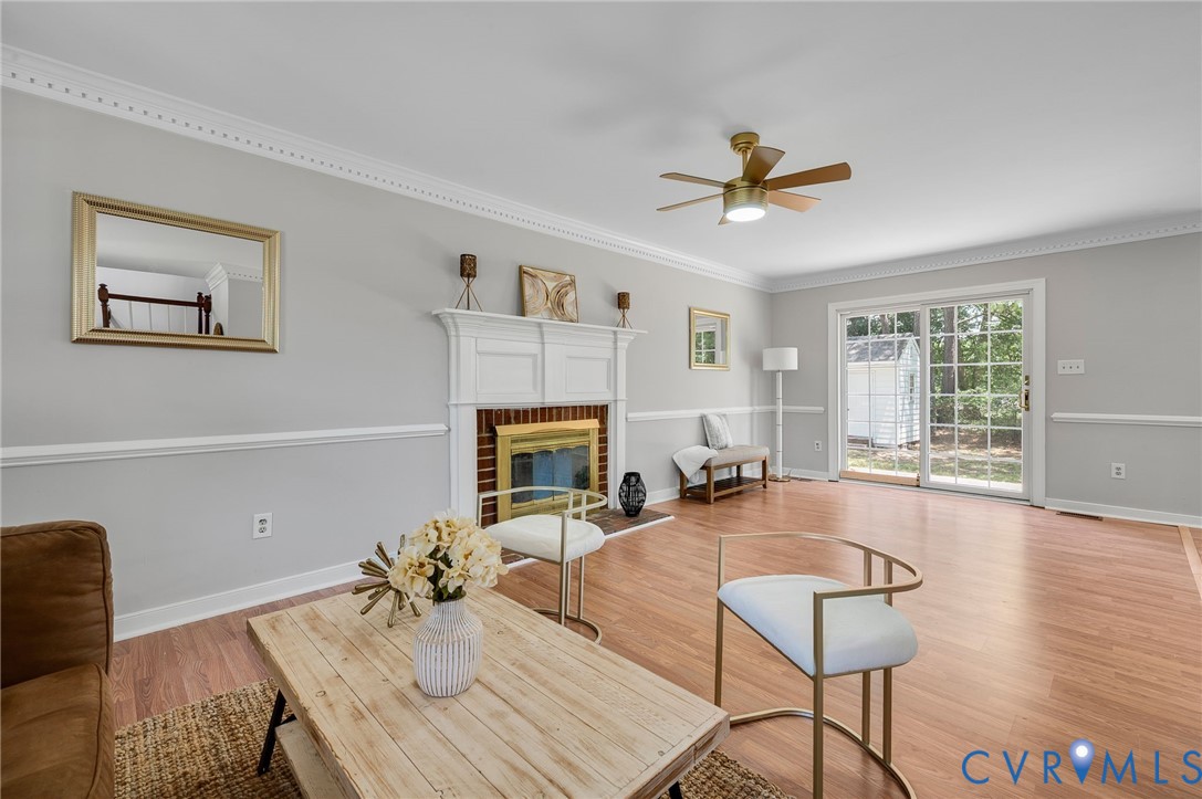 10110 Holly Road Mechanicsville, VA 23116 - Photo 8 of 26 Living area featuring wood-finish flooring, a whit