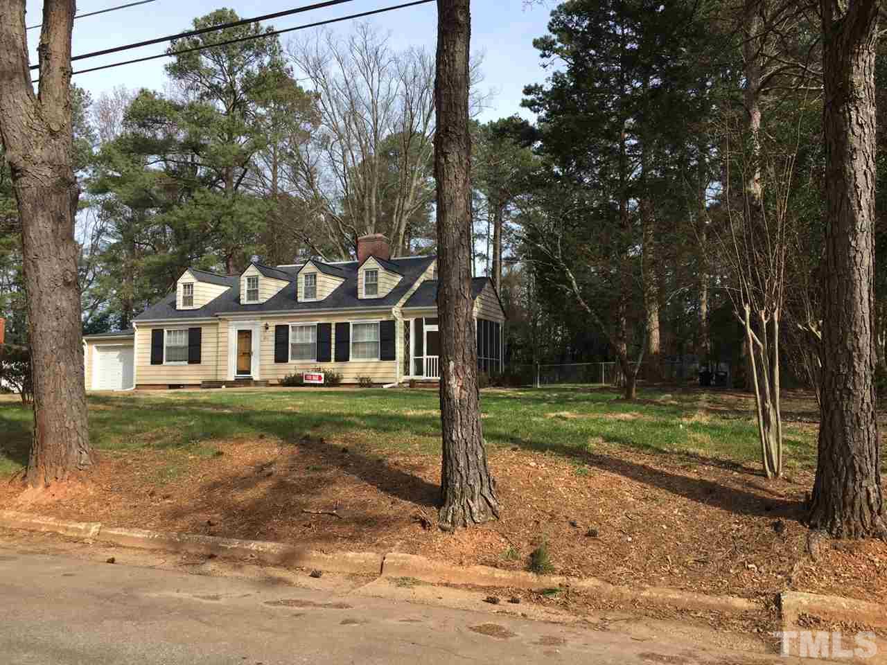 810 Chamberlain Street Raleigh, NC 27607 - Photo 2 of 16 a front view of a house with a yard