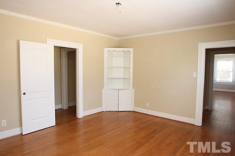 810 Chamberlain Street Raleigh, NC 27607 - Photo 5 of 16 an empty room with wooden floor and closet