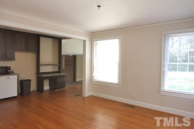 810 Chamberlain Street Raleigh, NC 27607 - Photo 6 of 16 a view of a kitchen with wooden floor and a window