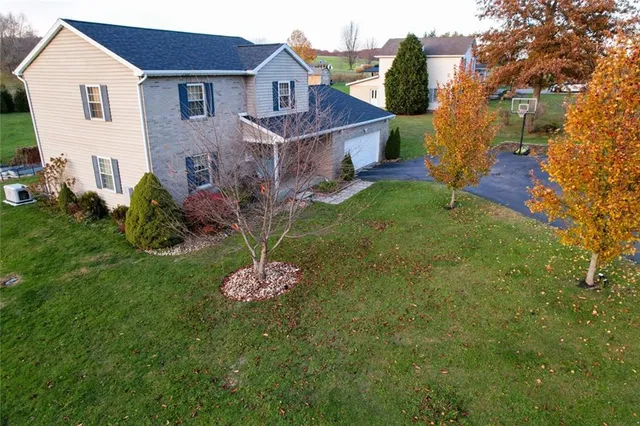 a front view of a house with a yard