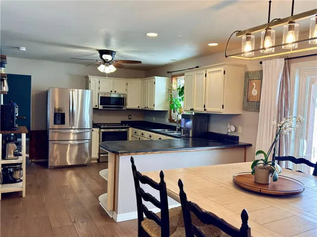 a bedroom with a bed closet and window