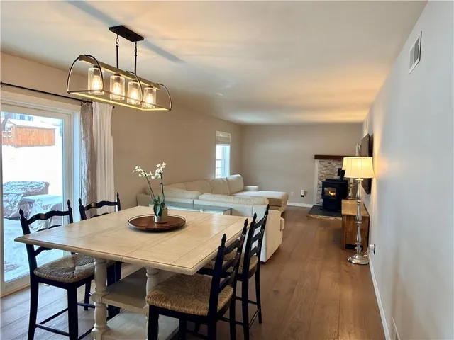 a bedroom with a bed and a view of kitchen