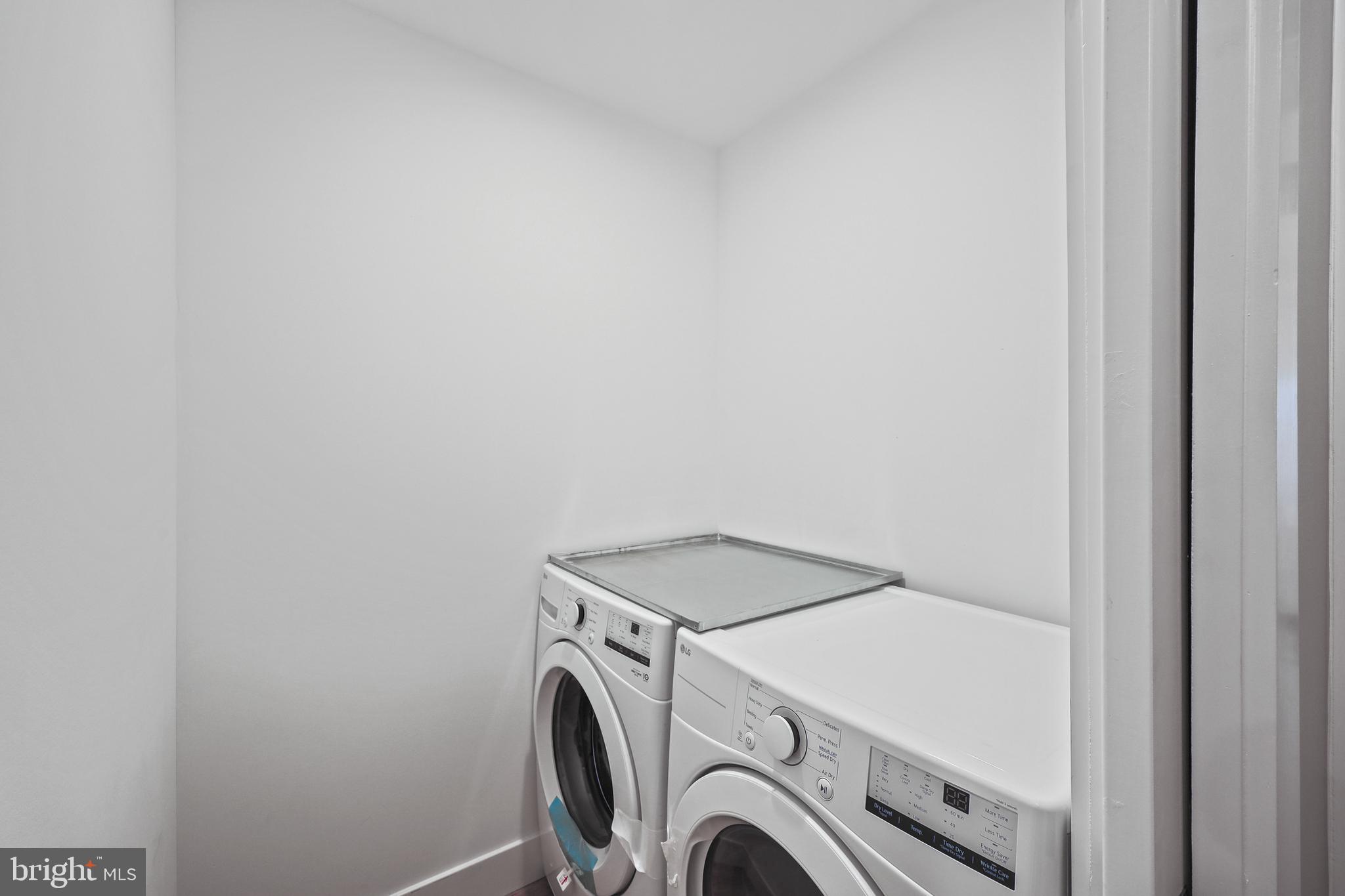 1465 Towson Street Baltimore, MD 21230 - Photo 25 of 39 a utility room with dryer and washer
