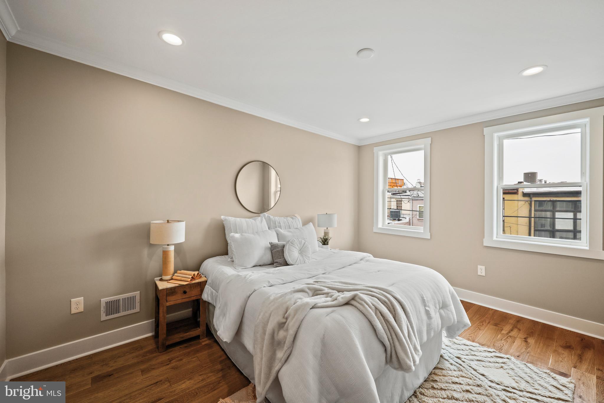 1465 Towson Street Baltimore, MD 21230 - Photo 3 of 39 a bedroom with a large bed and a window