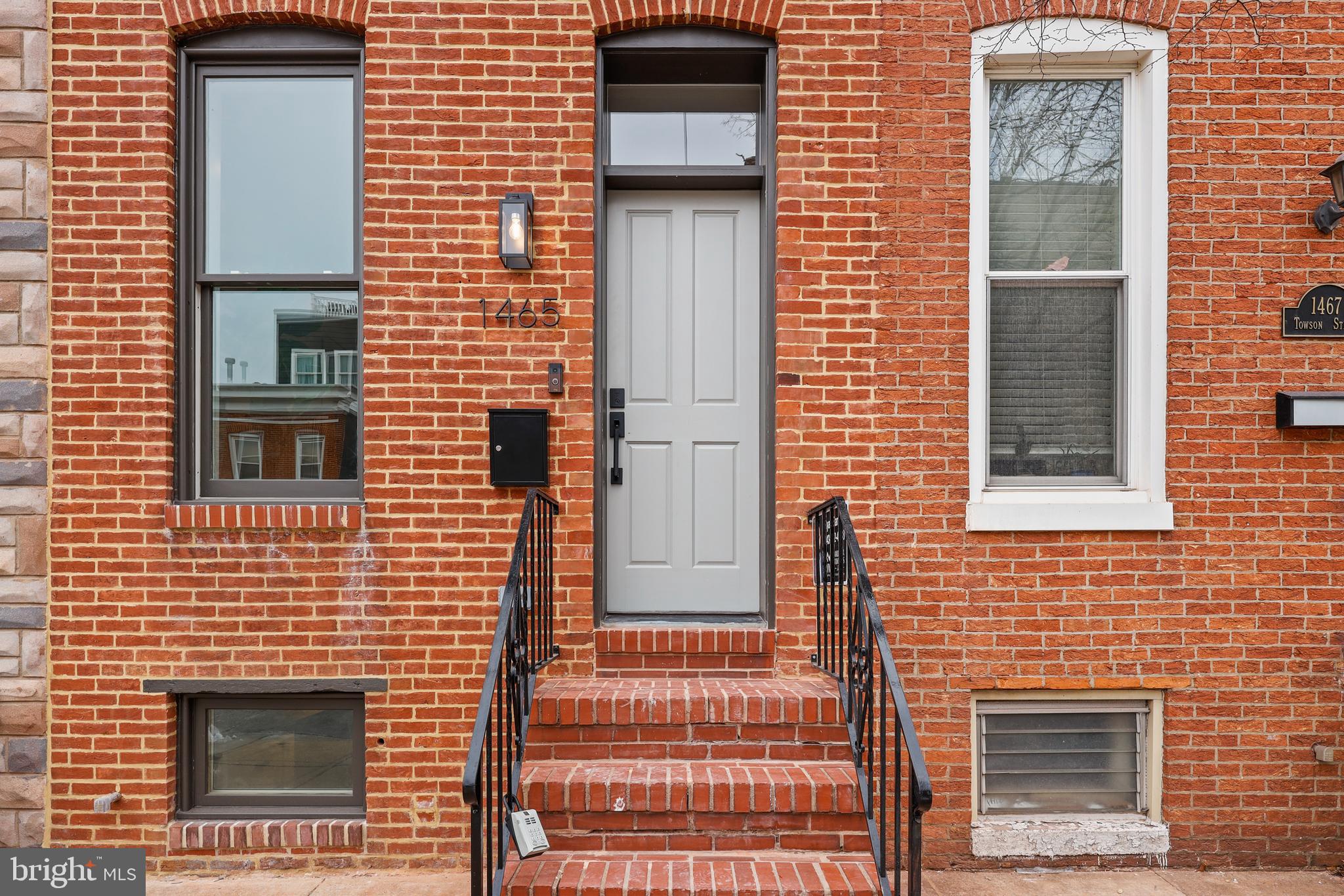 1465 Towson Street Baltimore, MD 21230 - Photo 37 of 39 a brick house with a door and a door