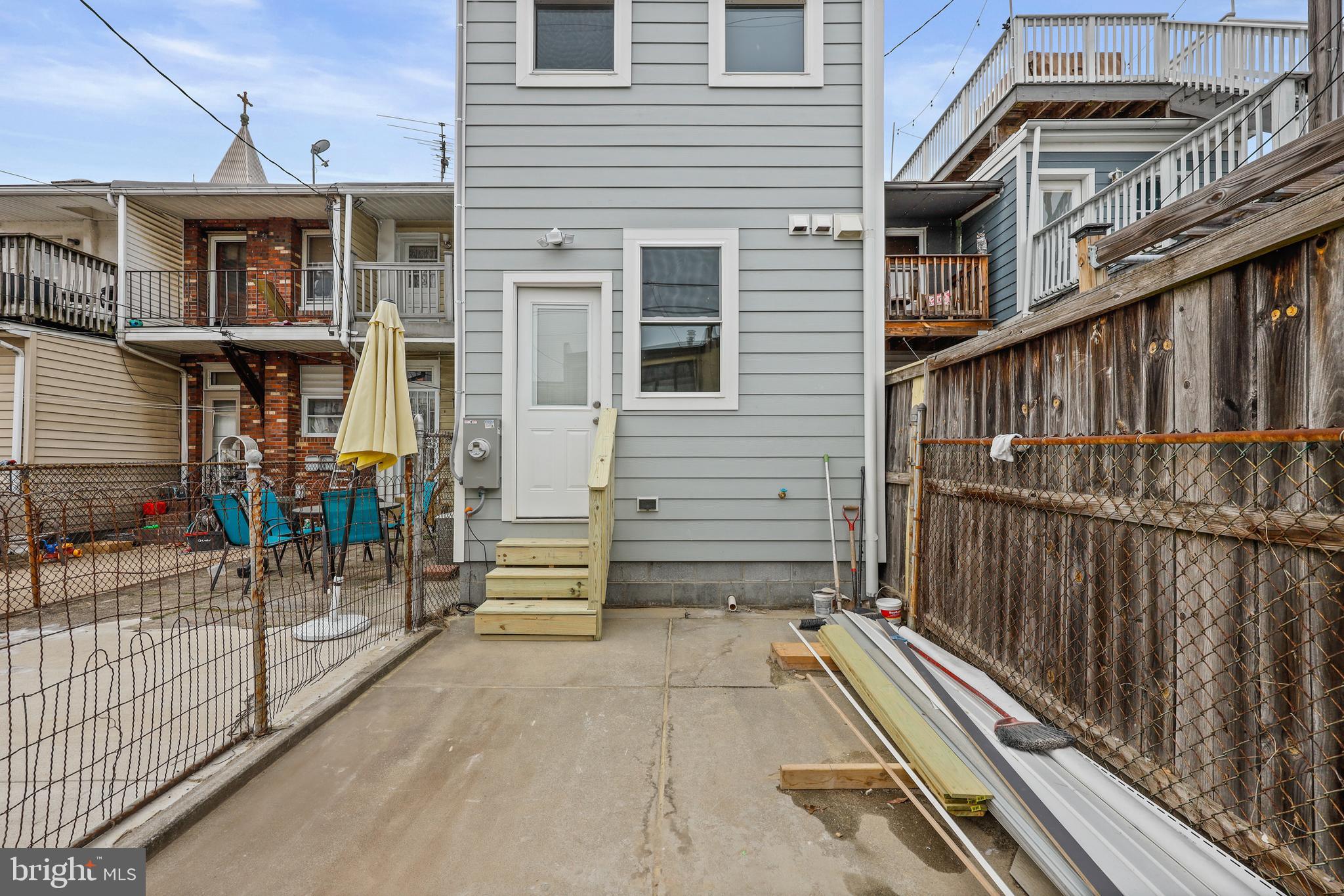 1465 Towson Street Baltimore, MD 21230 - Photo 38 of 39 a view of balcony with a potted plant and stairs