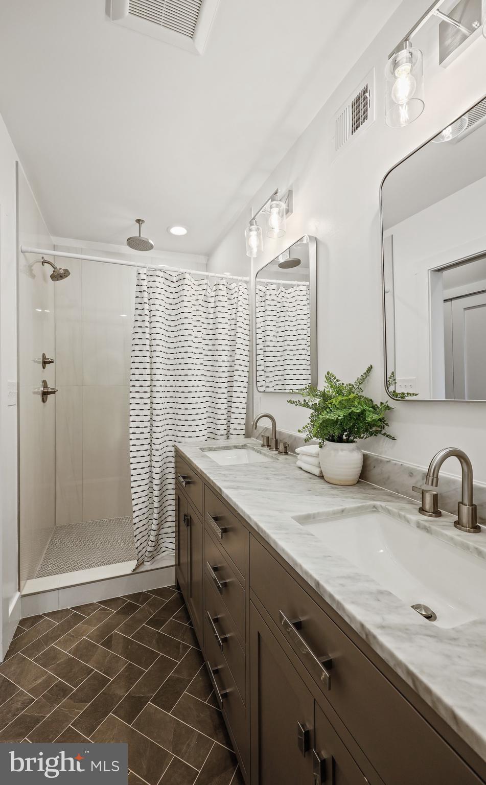 1465 Towson Street Baltimore, MD 21230 - Photo 4 of 39 a bathroom with a sink and a mirror