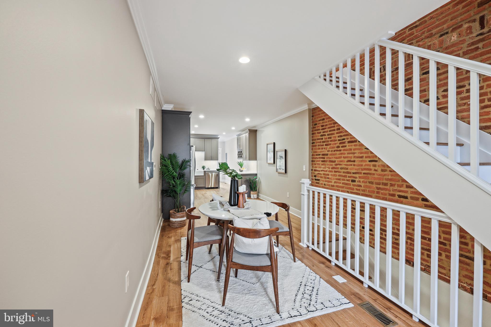 1465 Towson Street Baltimore, MD 21230 - Photo 6 of 39 a dining room with furniture and wooden floor