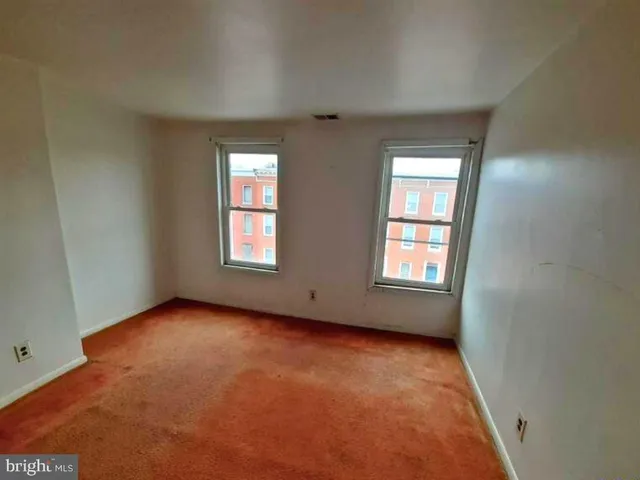 a view of a street with a building in the background