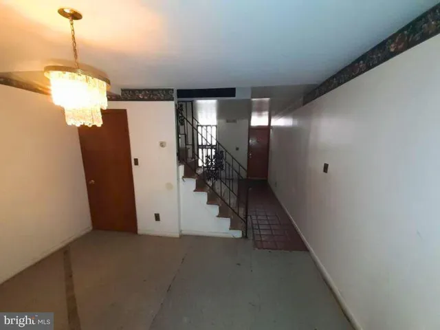 a view of a hallway with a chandelier