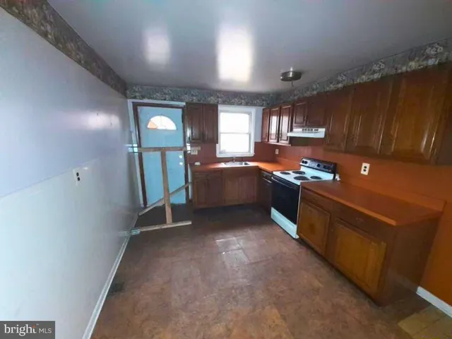 a room with furniture and a wooden floor