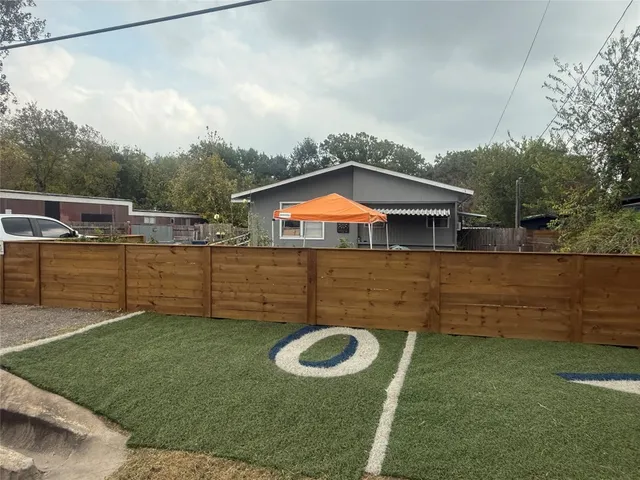 a backyard of a house with lots of green space
