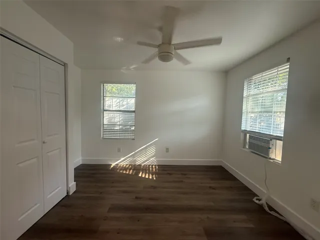 a view of entryway with wooden floor and window