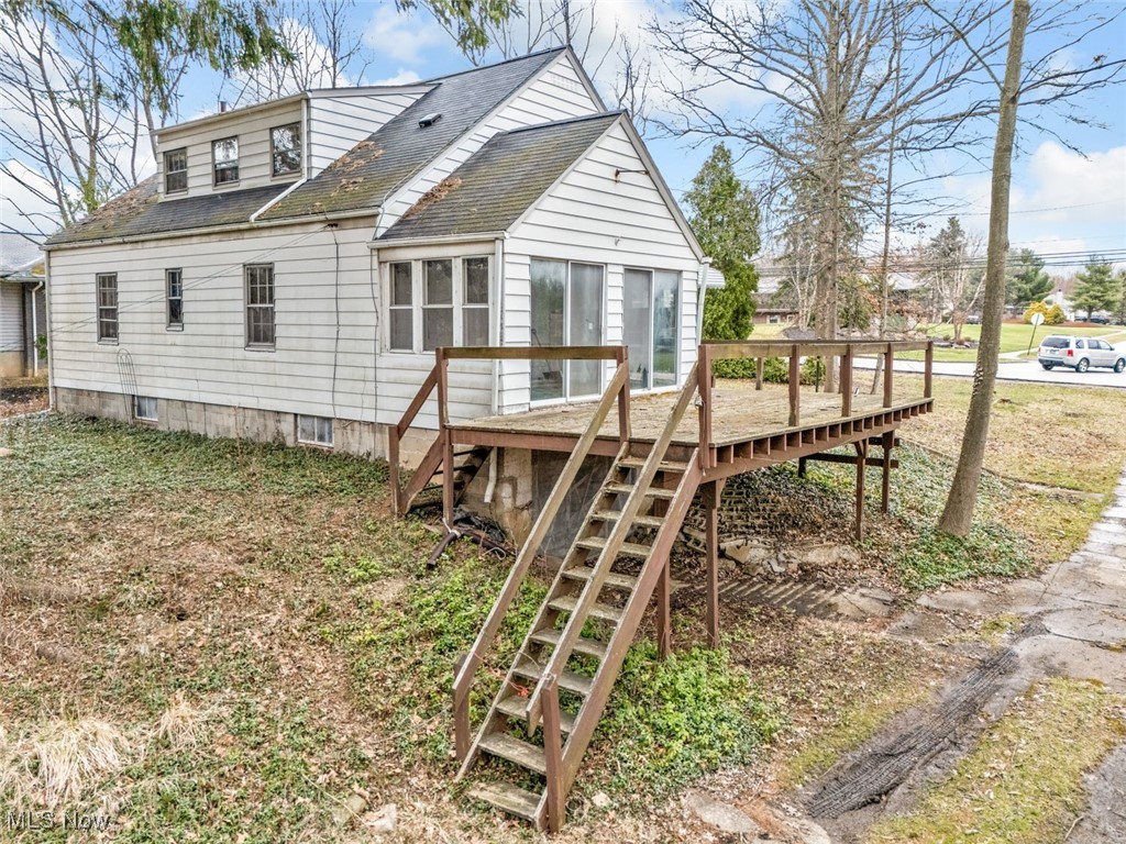 4468 Fishcreek Road Stow, OH 44224 - Photo 23 of 38 Rear view of house featuring roof with shingles, stairway, and a deck