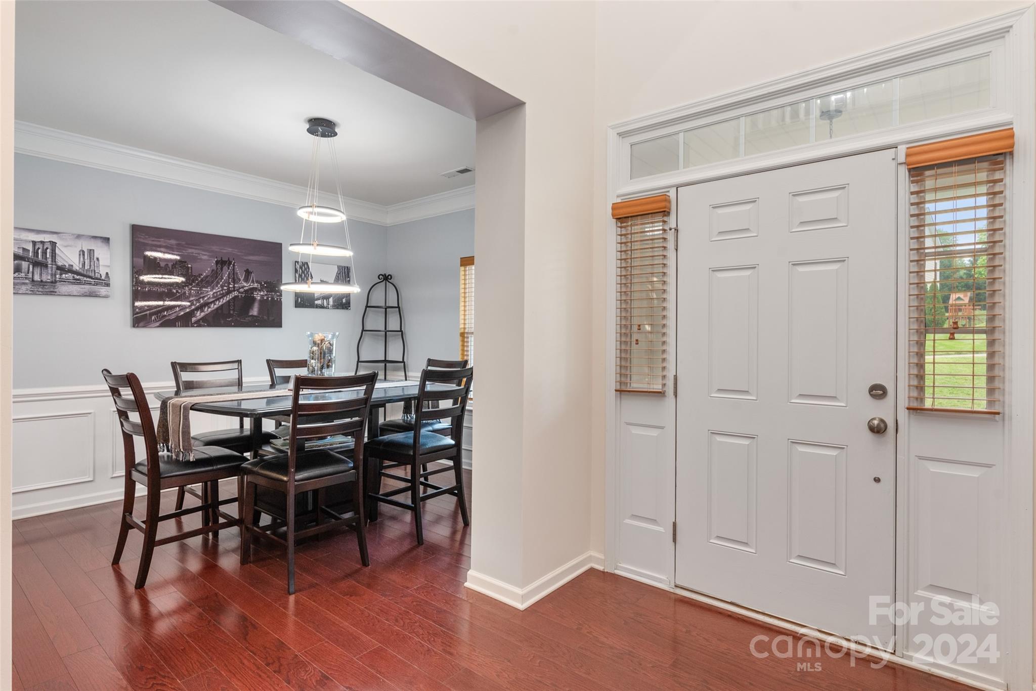6013 Fox Cub Indian Land, SC 29707 - Photo 4 of 30 a view of a dining room with furniture and wooden floor