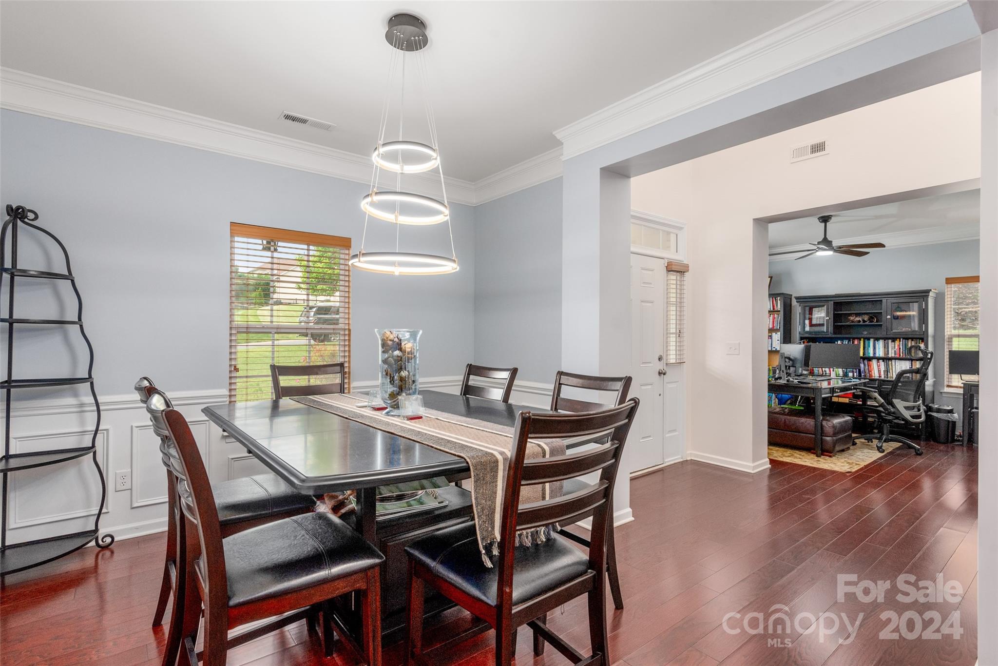 6013 Fox Cub Indian Land, SC 29707 - Photo 8 of 30 a view of a dining room with furniture and wooden floor