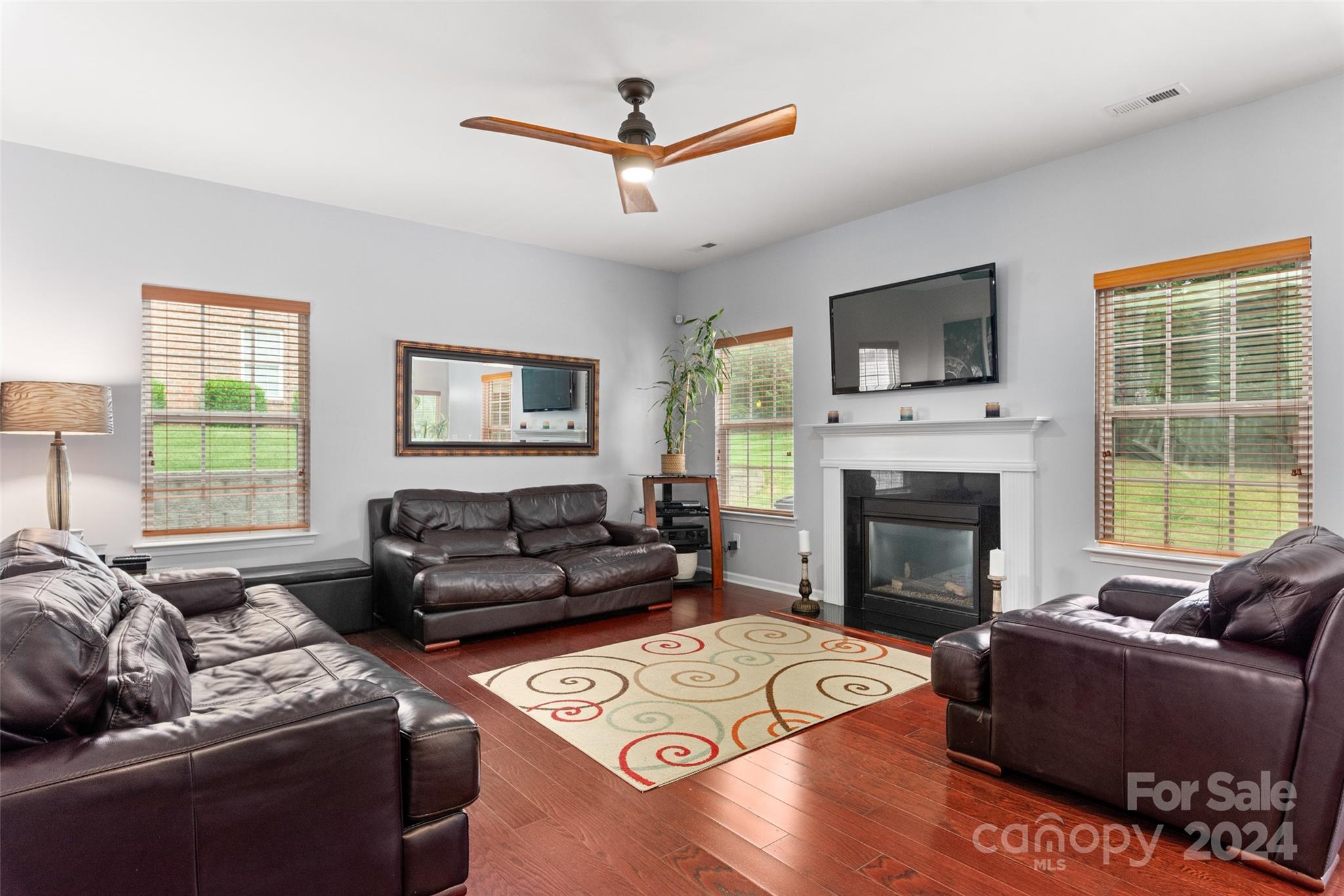 6013 Fox Cub Indian Land, SC 29707 - Photo 9 of 30 a living room with furniture a flat screen tv and a fireplace