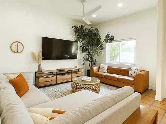 a bedroom with a bed and a table